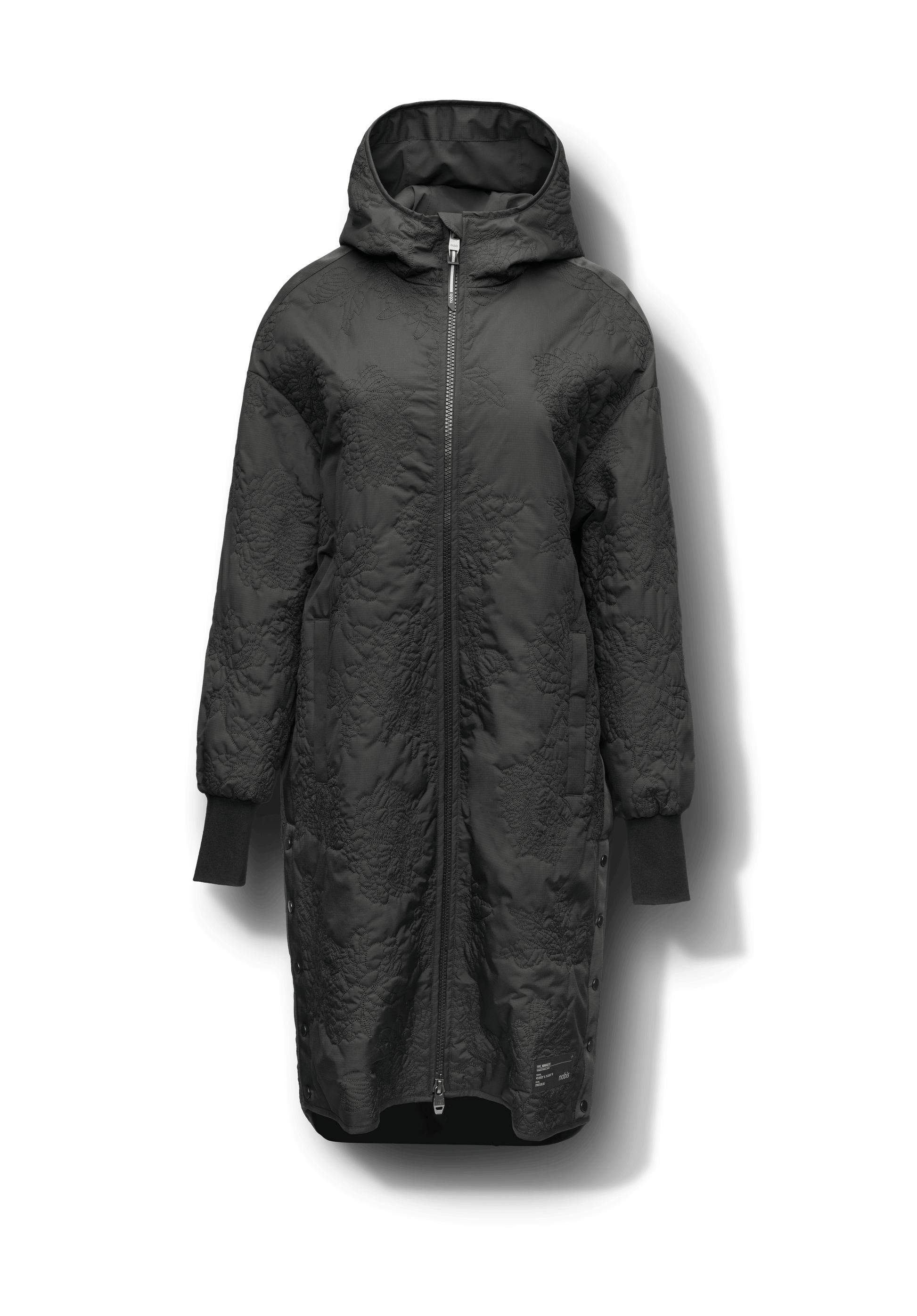 Surrey Women's Performance Quilted Long Mid Layer Jacket in knee length, Primaloft Gold Insulation Active+, non-removable hood, single welt magnetic closure pockets, ribbed cuffs, two-way centre front zipper, grosgrain ribbon detail and shoulders and side seam, and snap closure side seam vents, in Black