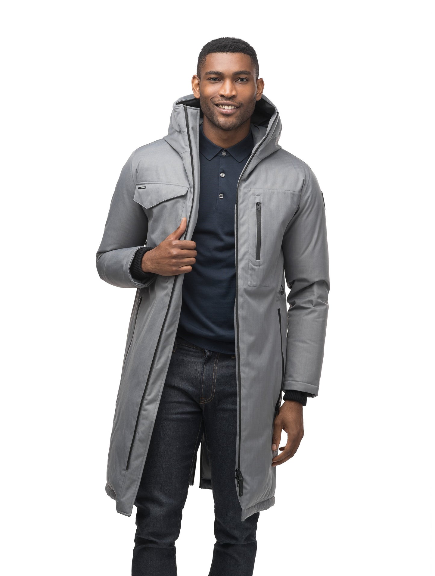 Long men's calf length parka with down fill and exposed zipper that features spacious pockets and zippered vents in Concrete