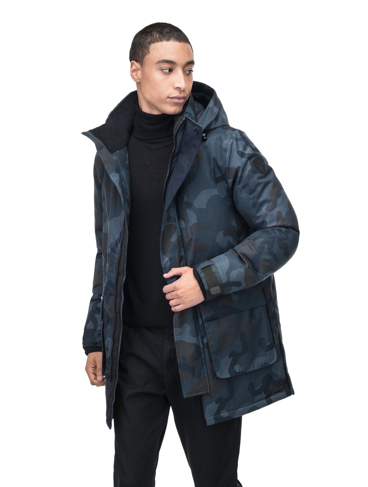 Mid weight men's down filled parka with two patch pockets at the hip and snap closure side vents in Navy Camo