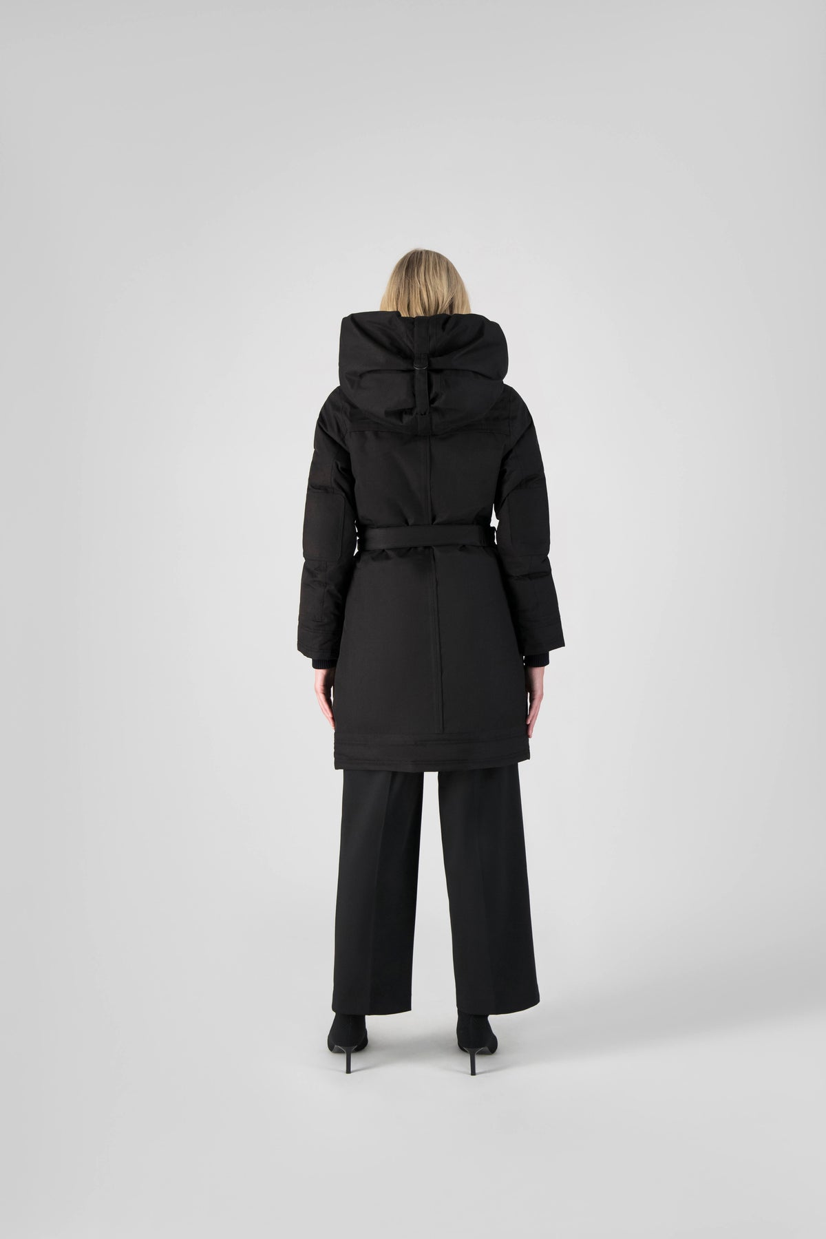Women's Thigh length own parka with a furless oversized hood in Black