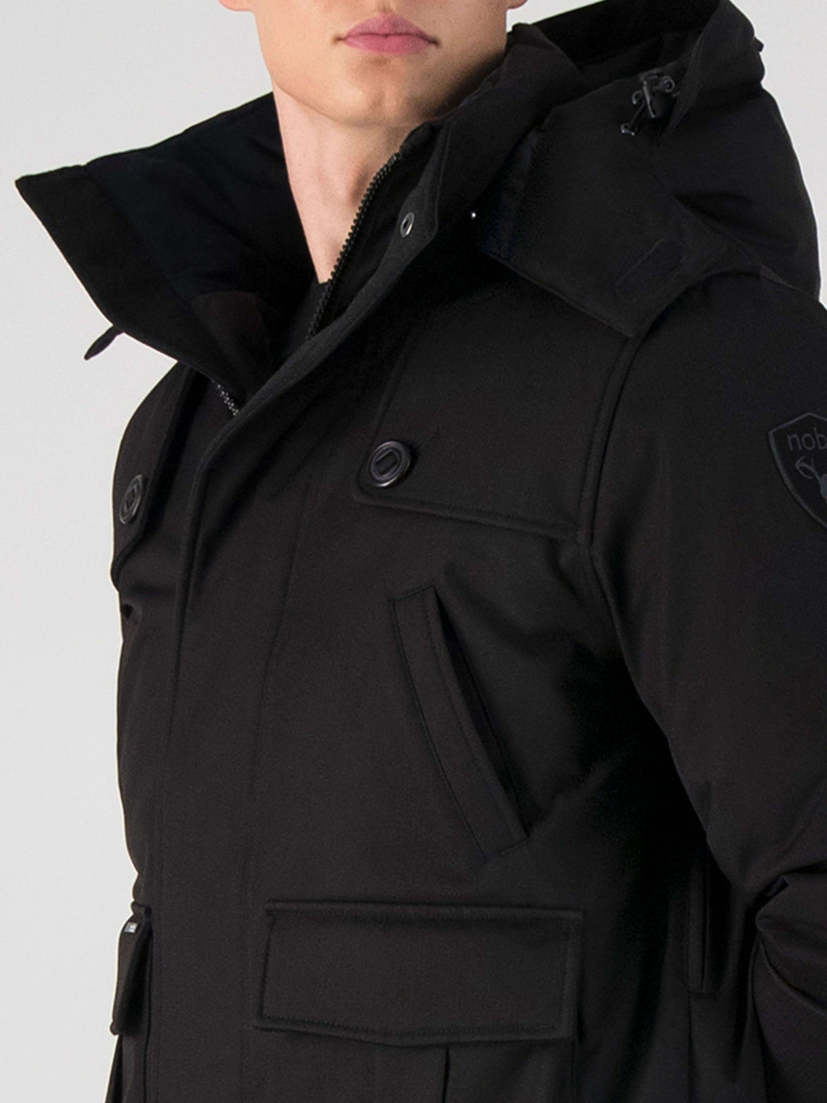 Men's down filled bomber that sits just above the hips with a completely removable hood that's windproof, waterproof, and breathable in Black