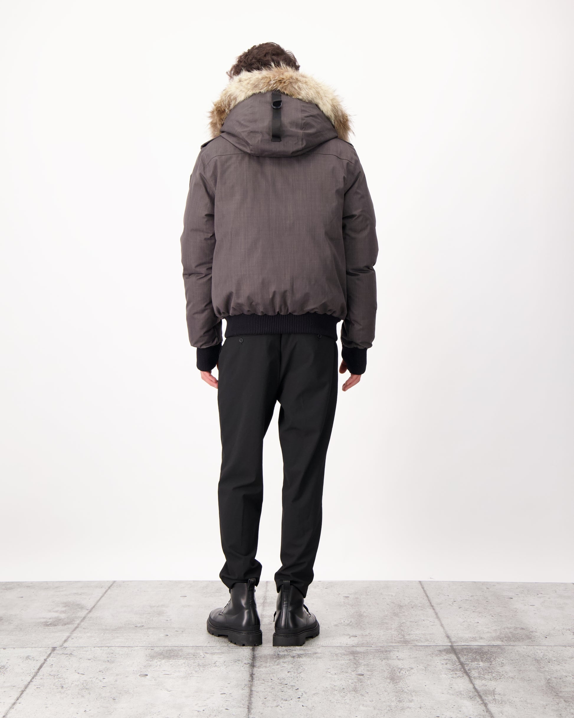 Men's down filled bomber that sits just above the hips with a completely removable hood that's windproof, waterproof, and breathable in CH Steel Grey