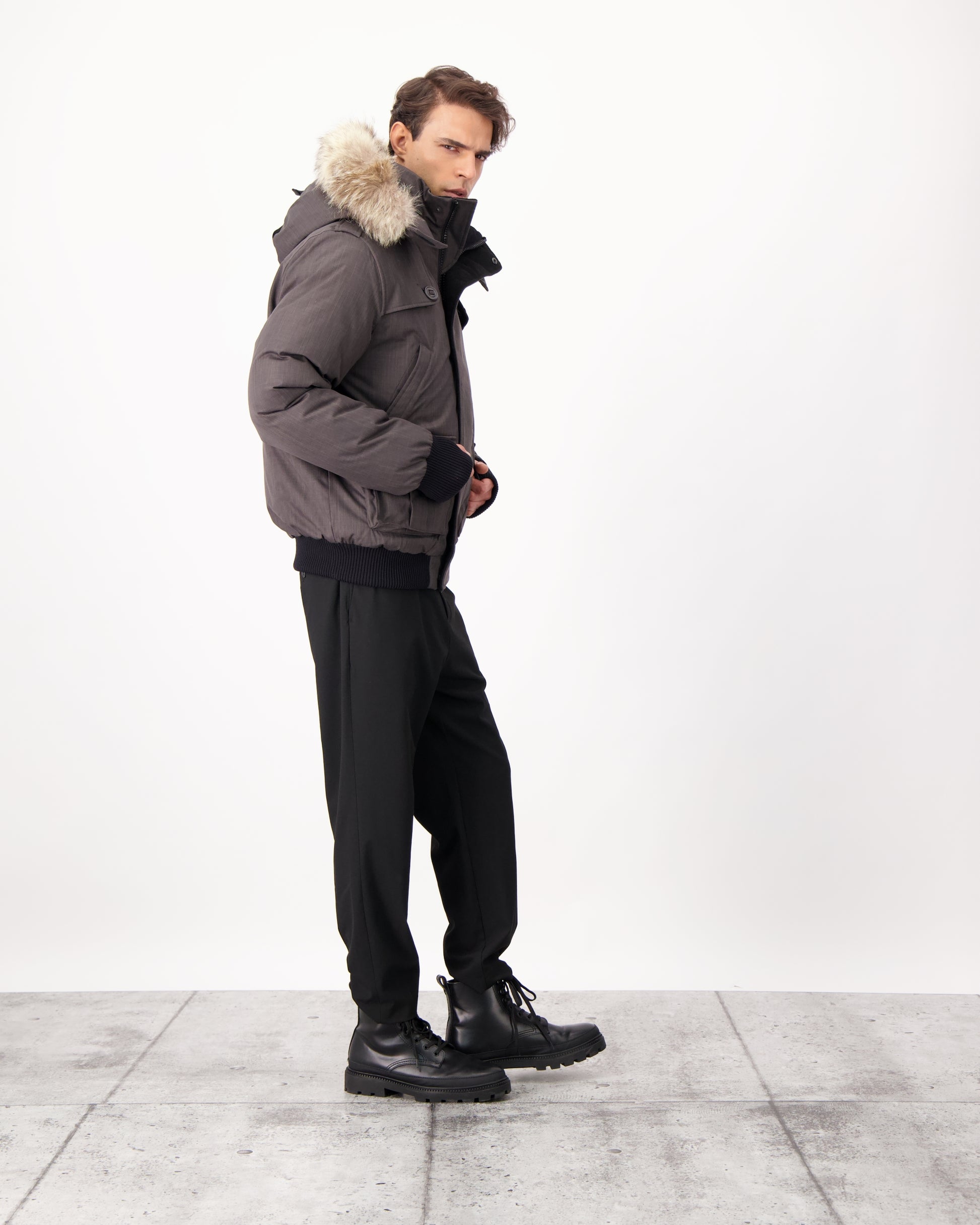 Men's down filled bomber that sits just above the hips with a completely removable hood that's windproof, waterproof, and breathable in CH Steel Grey