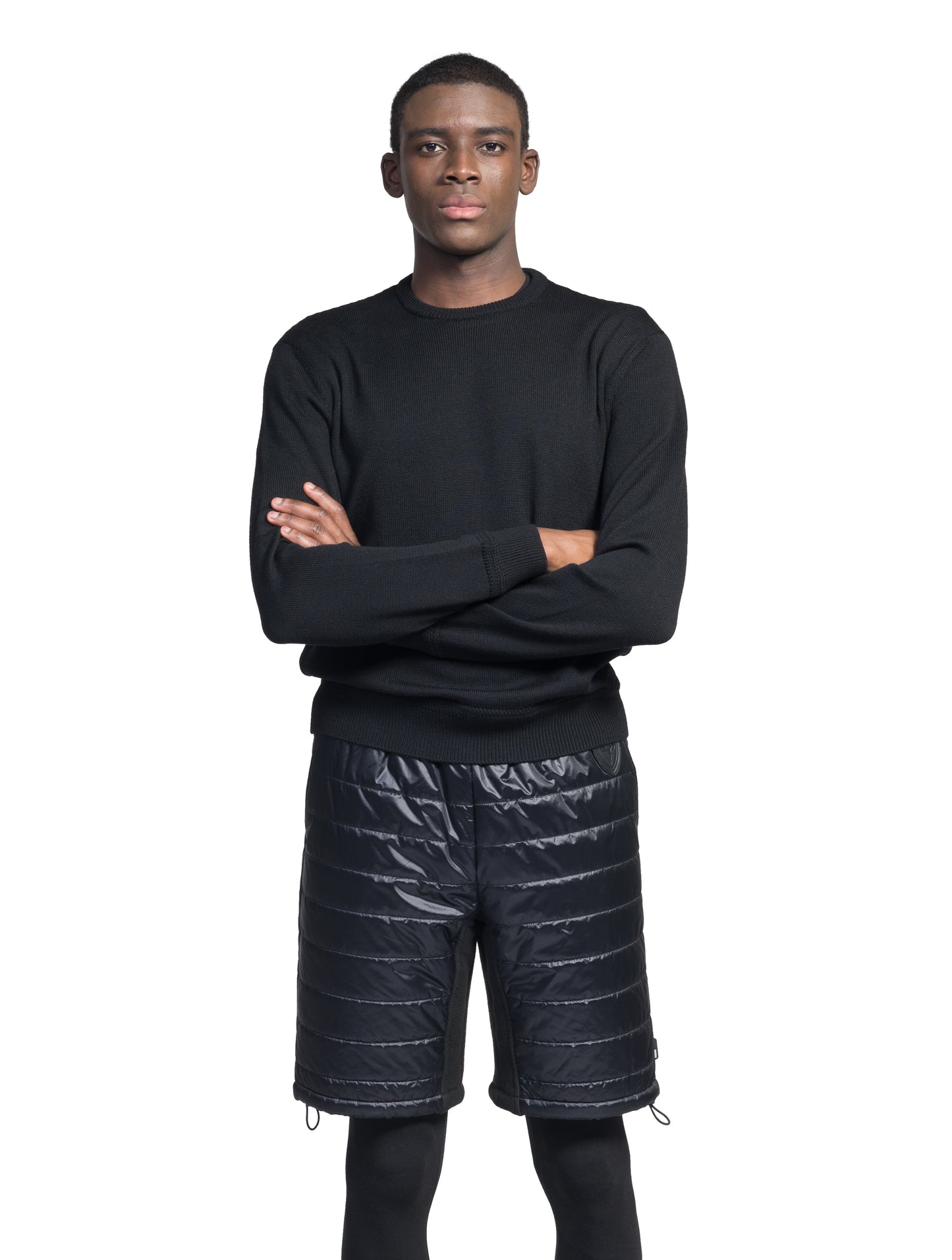 Decker Men's Performance Quilted Shorts in knee length, premium cire technical nylon taffeta and stretch nylon fabrication, premium 4-way stretch, water-resistant Primaloft Gold Insulation Active+, side seam pockets, invisible zipper back pokcet, elasticized waist with drawcords, and hidden drawcord at leg hems, in Black