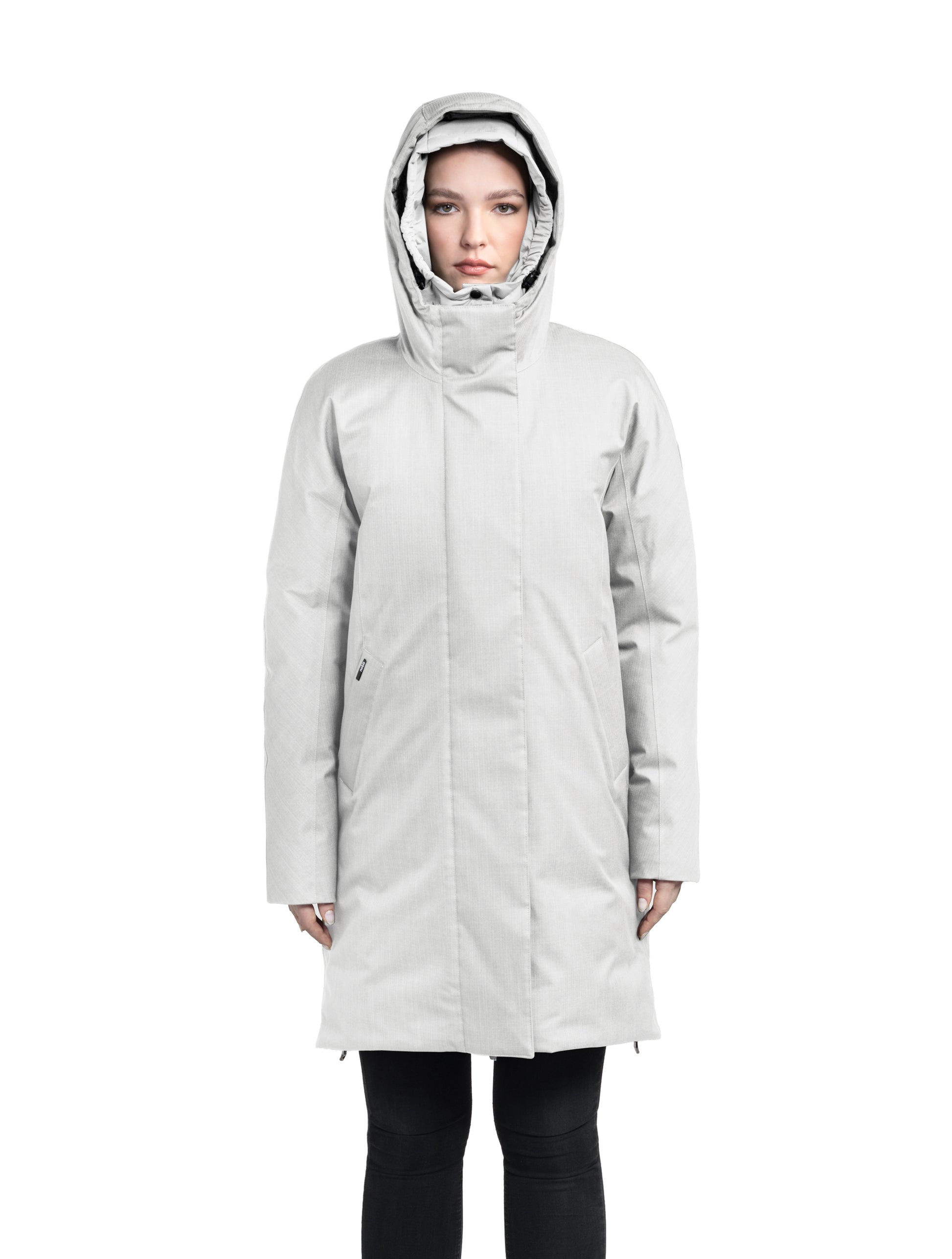 Dory Women's Tailored Back Zip Parka in knee length, premium Crosshatch fabrication, Premium Canadian White Duck Down insulation, non-removable down-filled hood, removable interior hood, centre front two-way zipper with wind flap, vertical zipper detailing along back, in Light Grey