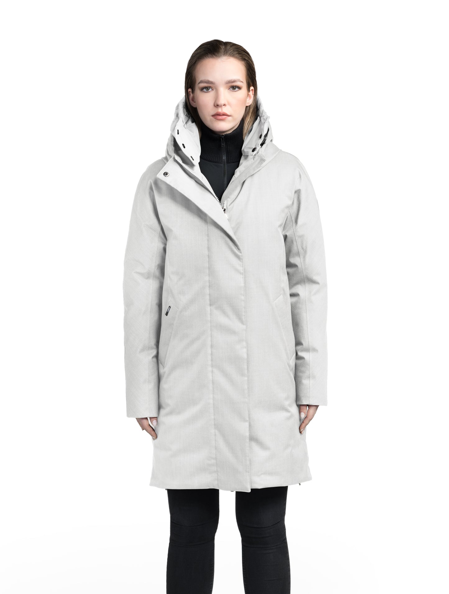 Dory Women's Tailored Back Zip Parka in knee length, premium Crosshatch fabrication, Premium Canadian White Duck Down insulation, non-removable down-filled hood, removable interior hood, centre front two-way zipper with wind flap, vertical zipper detailing along back, in Light Grey