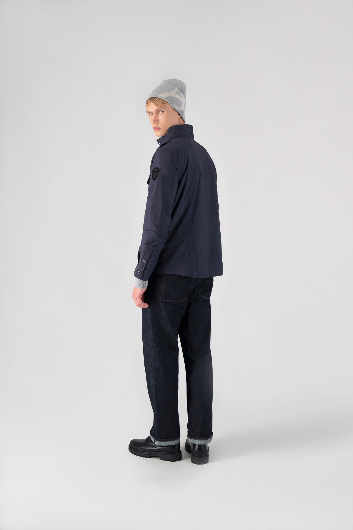 Fisherman is a men’s lightweight waterproof jacket offering exceptional durability, crafted from matte technical taffeta with a breathable, seam-sealed construction for dependable weather protection in Marine