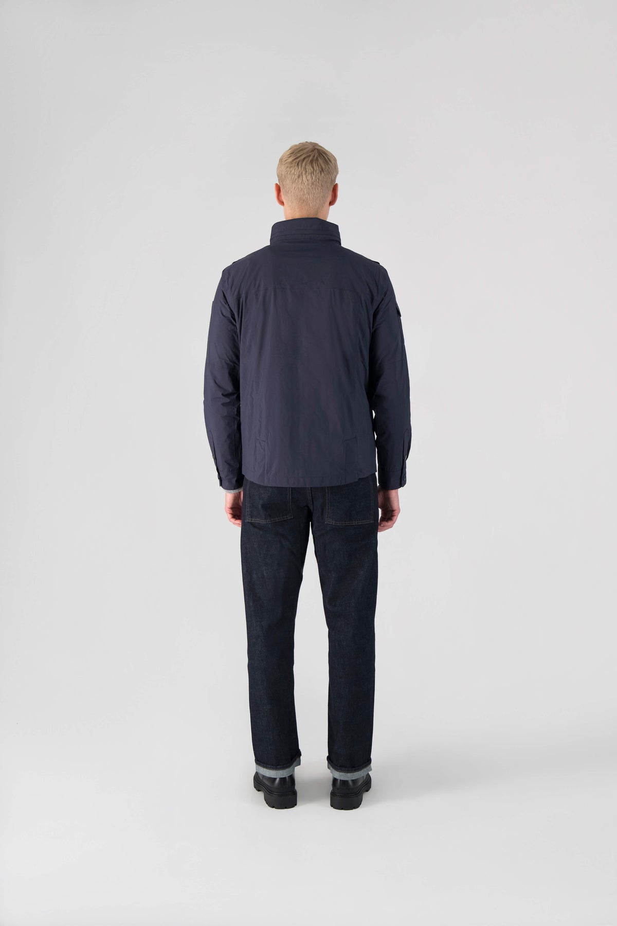 Fisherman is a men’s lightweight waterproof jacket offering exceptional durability, crafted from matte technical taffeta with a breathable, seam-sealed construction for dependable weather protection in Marine