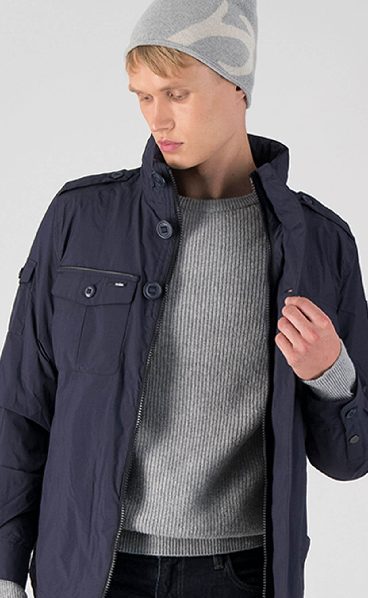 Fisherman is a men’s lightweight waterproof jacket offering exceptional durability, crafted from matte technical taffeta with a breathable, seam-sealed construction for dependable weather protection in Marine