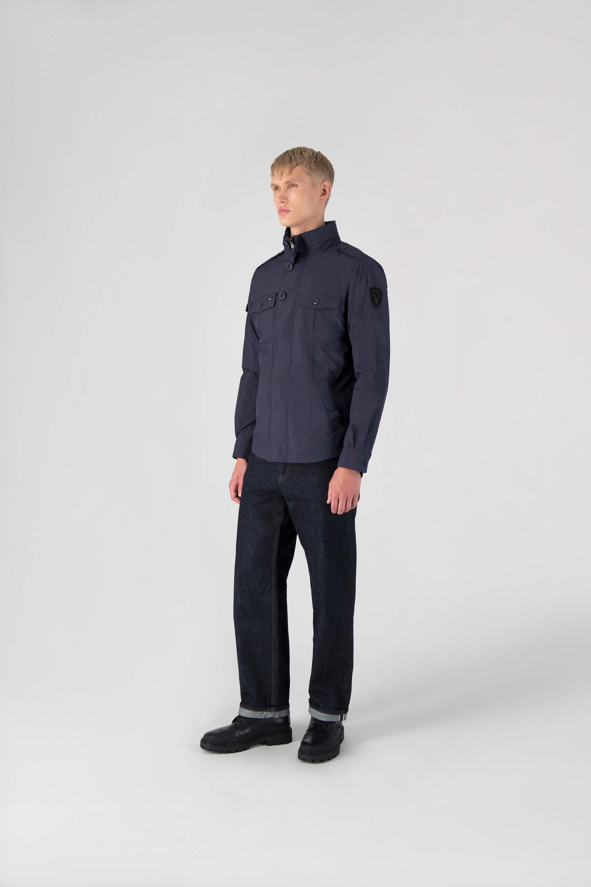 Fisherman is a men’s lightweight waterproof jacket offering exceptional durability, crafted from matte technical taffeta with a breathable, seam-sealed construction for dependable weather protection in Marine