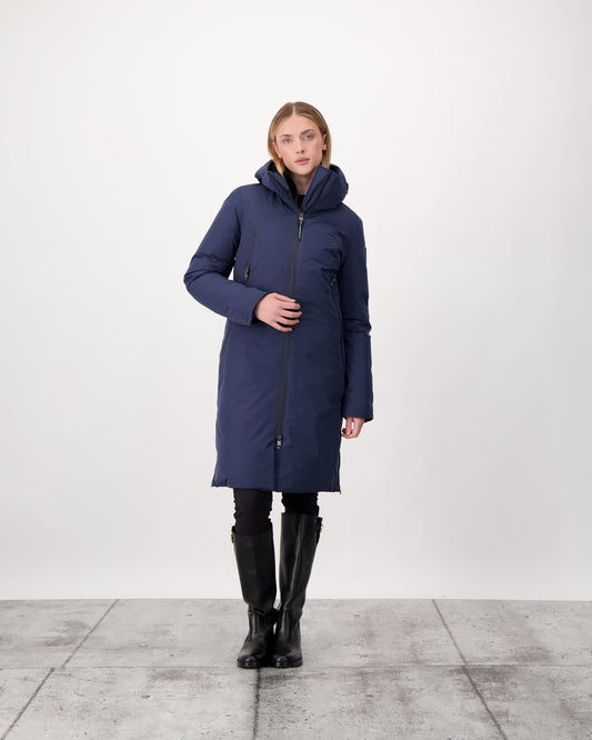 Inara Women's Performance Parka in knee length, premium 3-ply micro denier and stretch ripstop fabrication with DWR coating, Premium Canadian White Duck Down insulation, non-removable down-filled hood, centre front two-way zipper, large vertical zipper pockets along waist, zipper vents along bottom side hem, in Marine