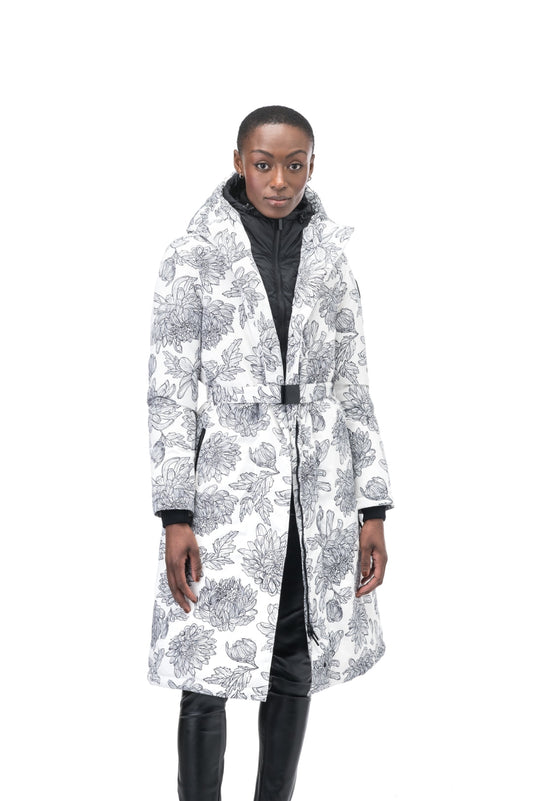 Long calf length hooded women's winter parka with an inner hip length closure, exterior hem length zipper and magnetic placket in White Floral + White Floral