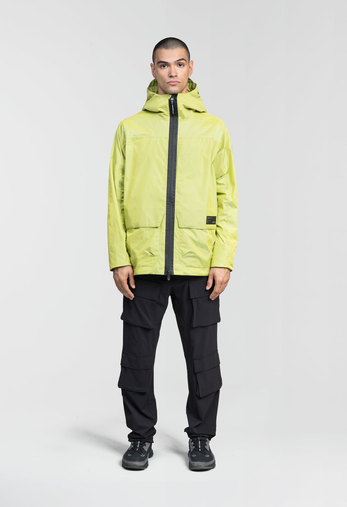 Mission Men's Performance Rain Shell Jacket in hip length, non-removable hood with adjustable toggle, two-way waterproof zipper, flap closure waist pockets with additional side entry storage, zipper ventilation on back, passive underarm ventilation, and breathable mesh lining, in Sulphur Spring