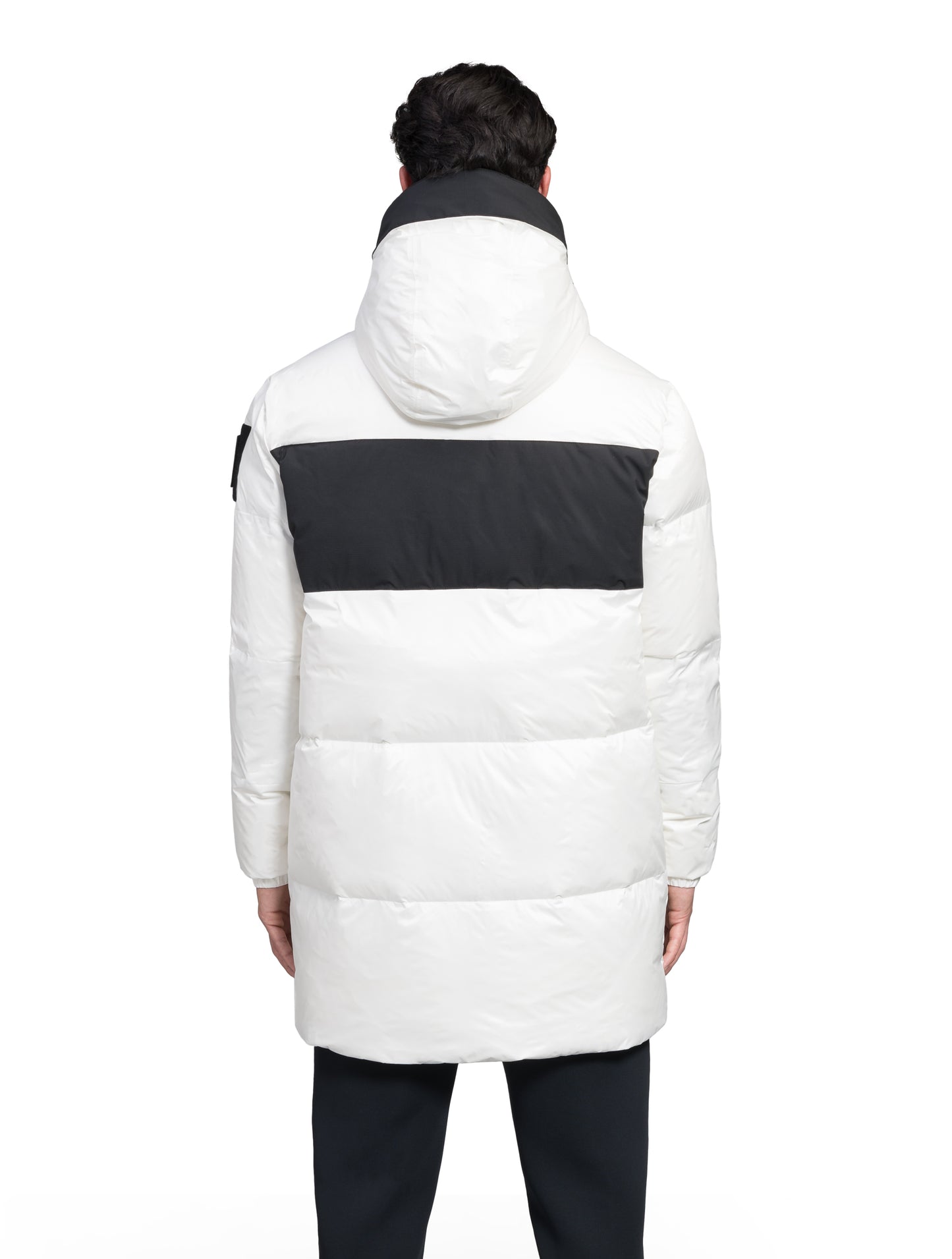 Neelix Men's Long Puffer Jacket in thigh length, premium cire technical nylon taffeta and stretch ripstop fabrication, Premium Canadian origin White Duck Down insulation, non-removable down-filled hood, two-way centre-front zipper, pit zipper vents, hidden chest zipper pockets, fleece-lined magnetic closure waist pockets, in Chalk