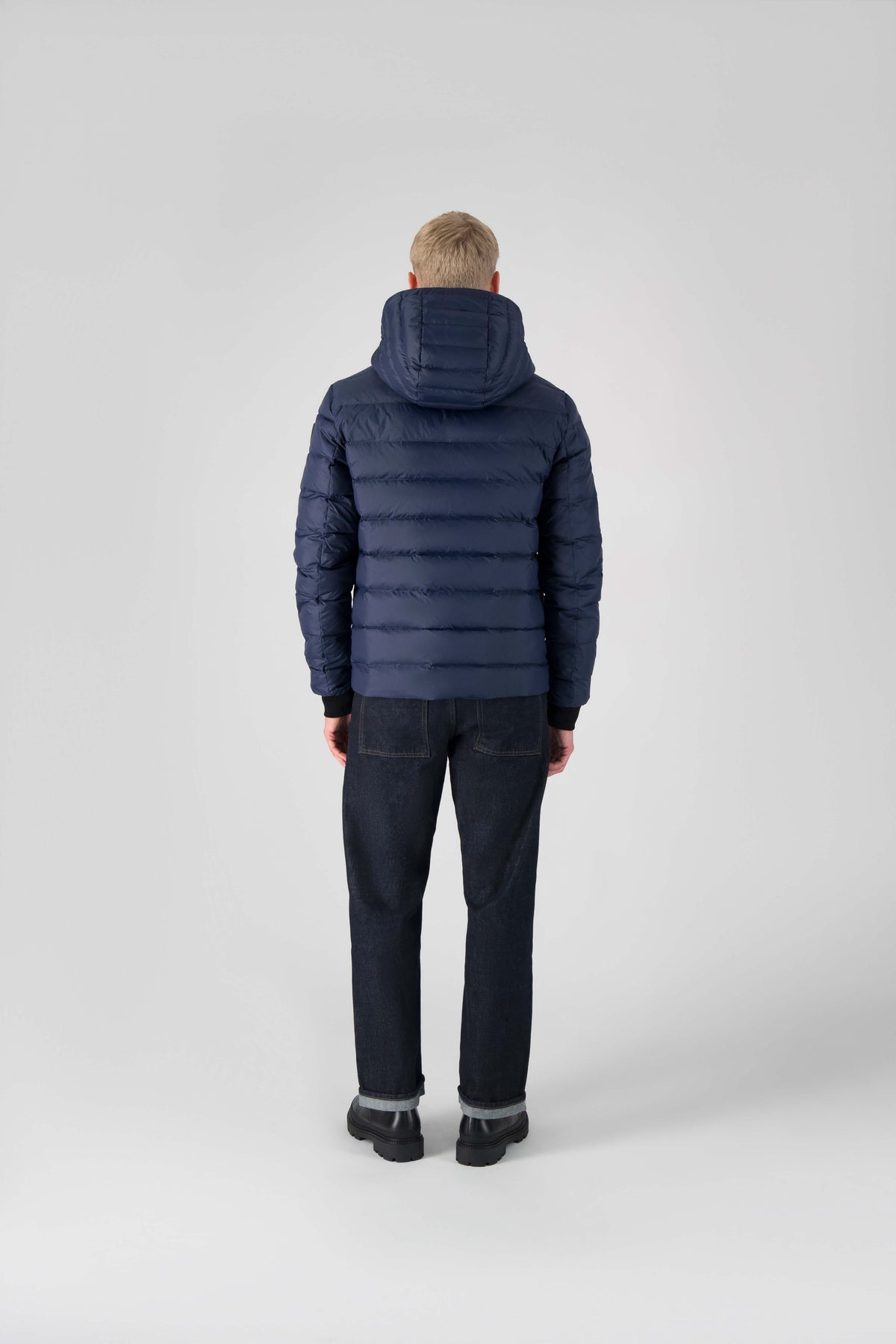 Hip length, reversible men's down filled jacket with removable hood in Marine