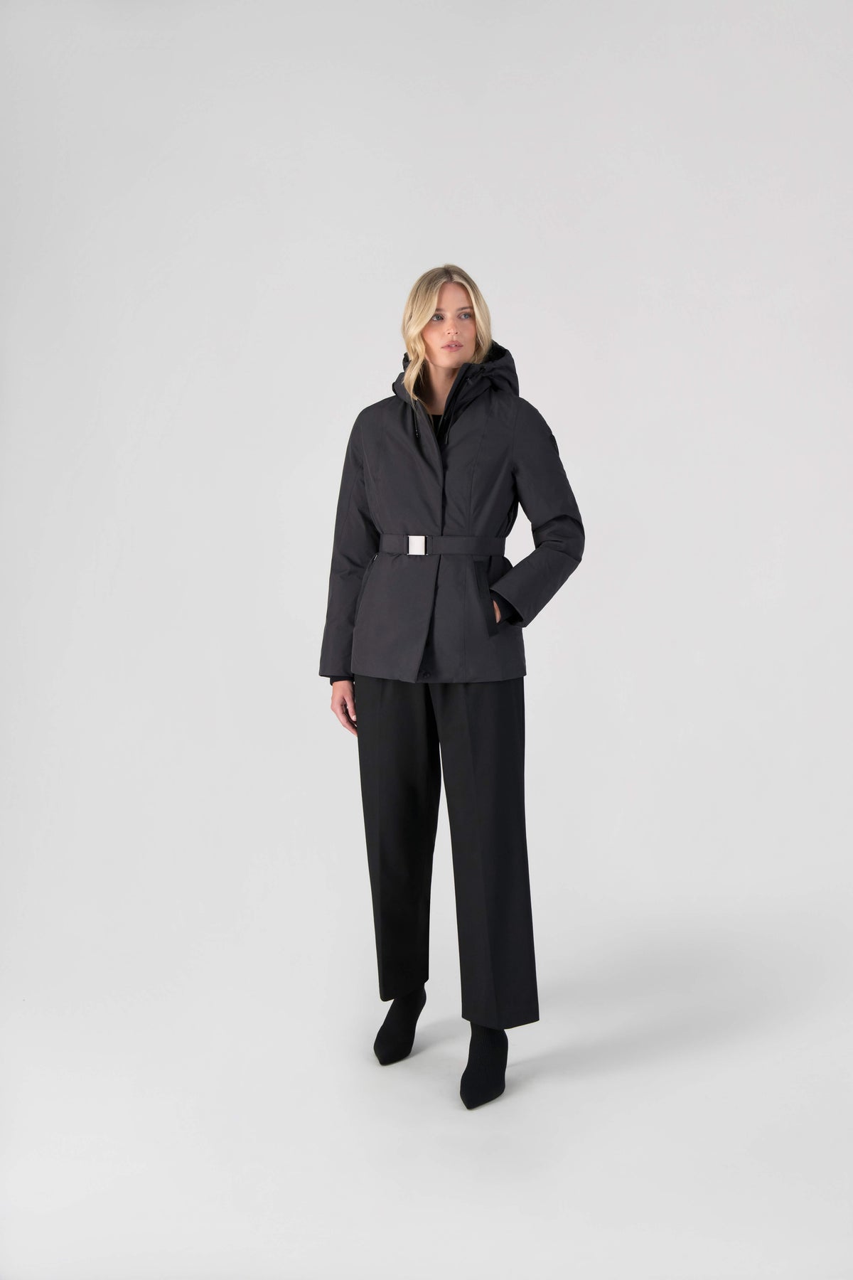 Ladies hip length down-filled parka with non-removable hood and adjustable belt in Black