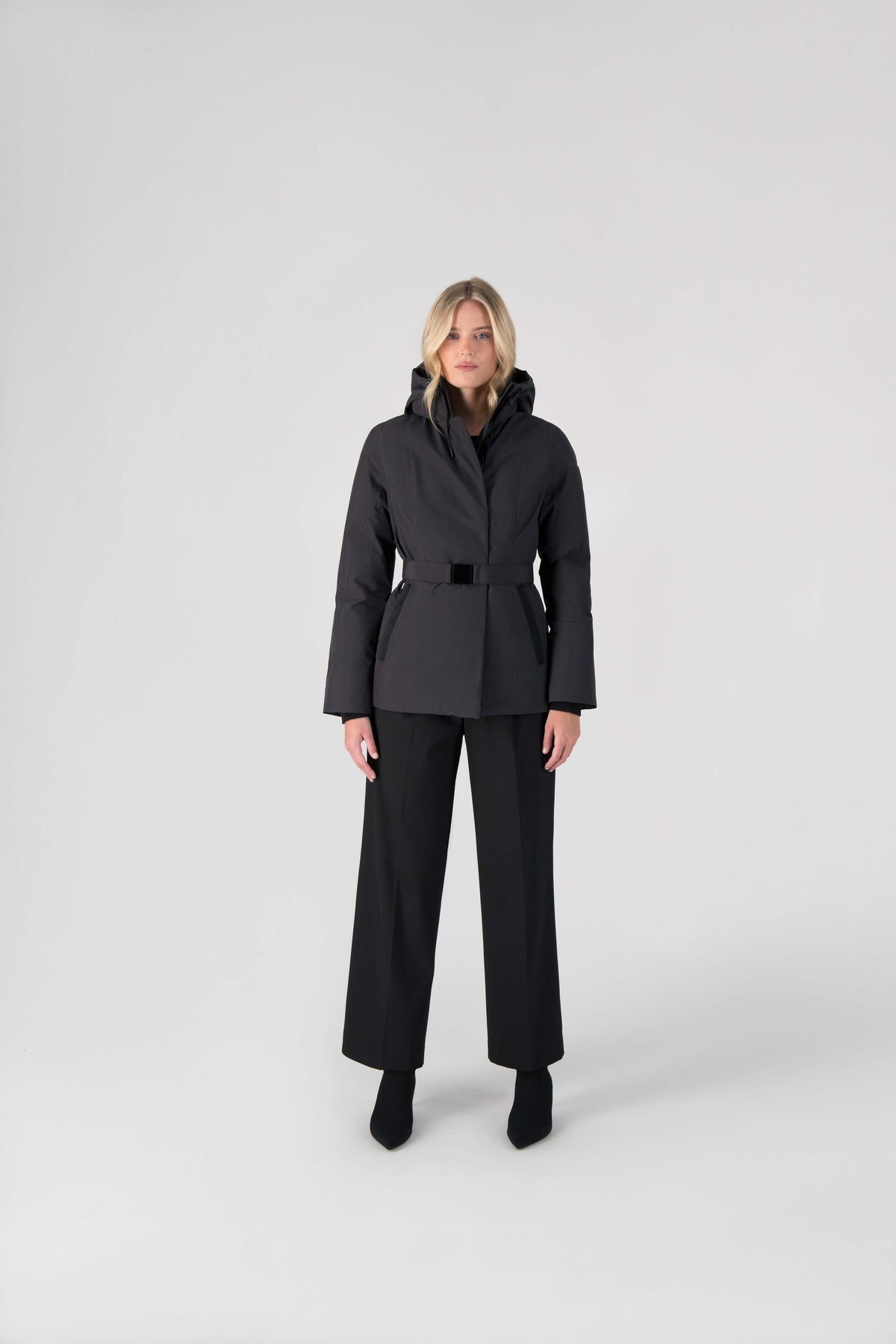 Ladies hip length down-filled parka with non-removable hood and adjustable belt in Black