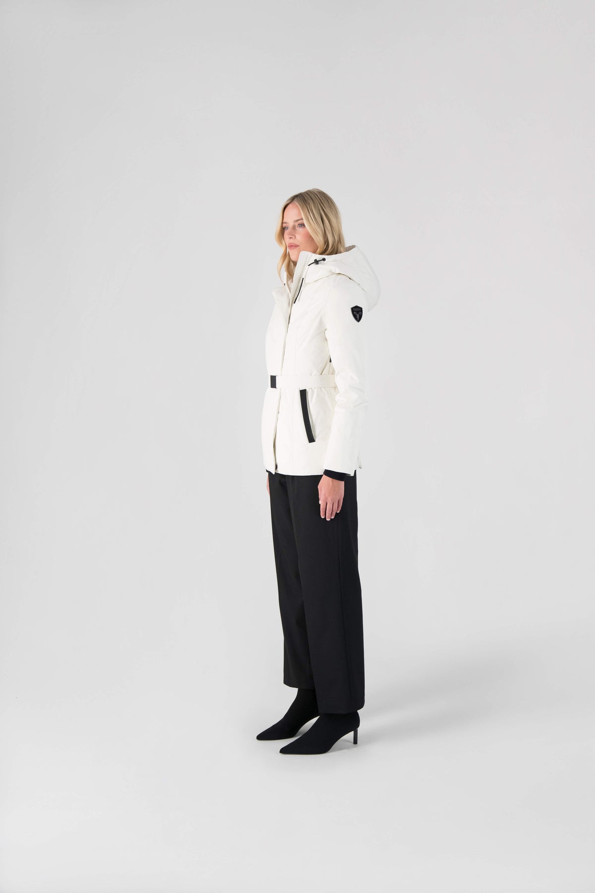 Ladies hip length down-filled parka with non-removable hood and adjustable belt in Chalk