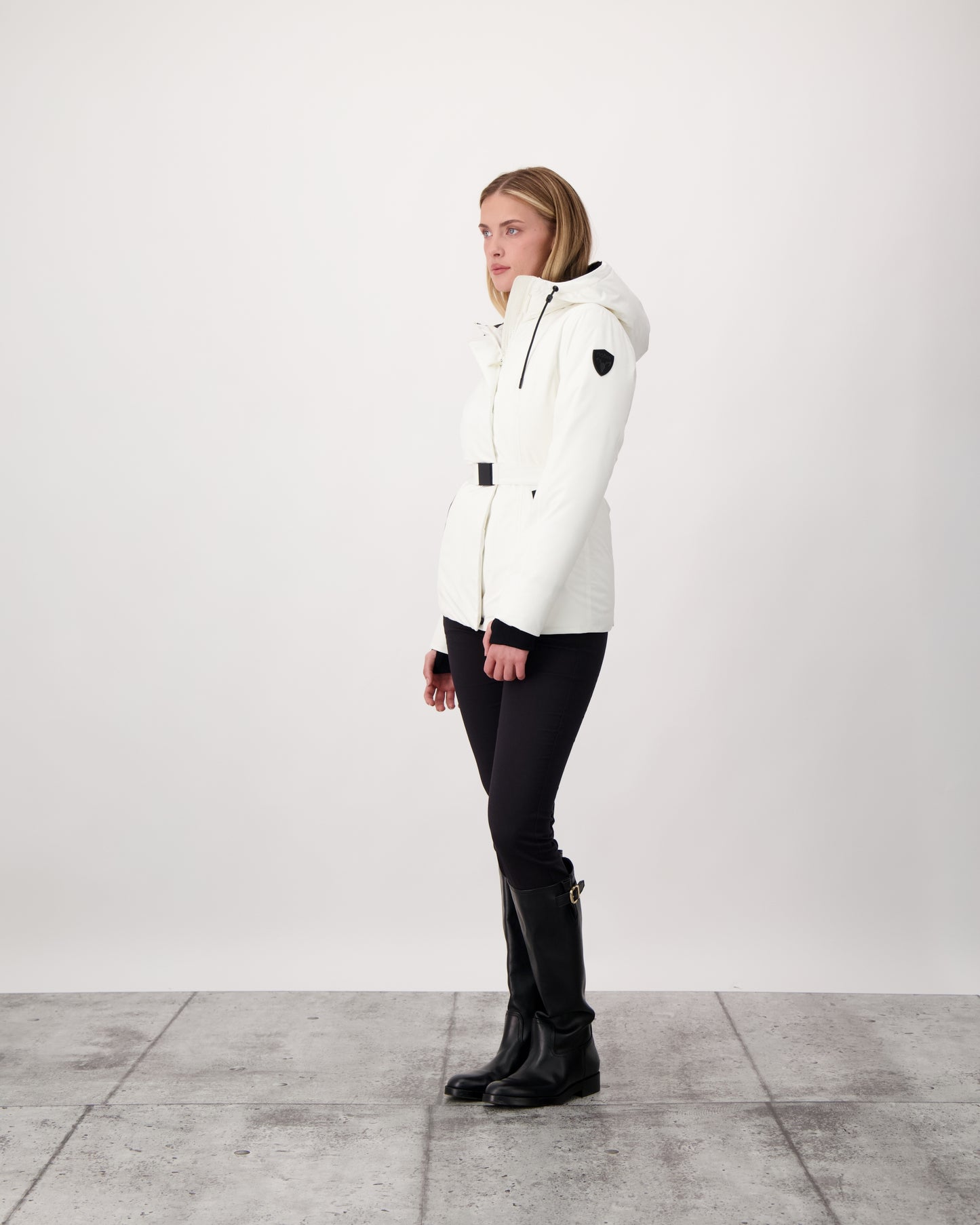 Ladies hip length down-filled parka with non-removable hood and adjustable belt in Chalk
