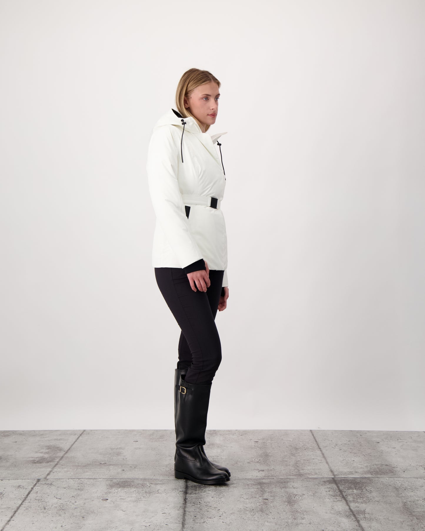Ladies hip length down-filled parka with non-removable hood and adjustable belt in Chalk