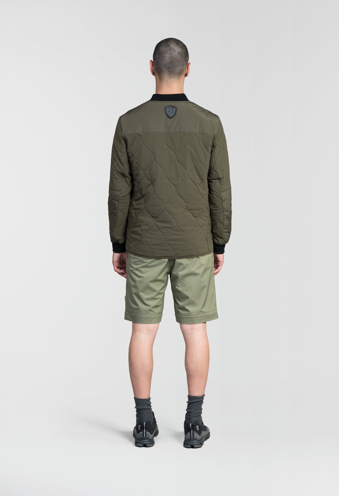 Speck Men's Tailored Mid Layer Jacket in hip length, Primaloft Gold Insulation Active+, diamond quilted body, rib knit collar and cuffs, snap buton front closure, and hidden side-entry zipper pockets at waist, in Fatigue