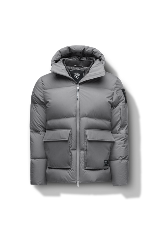 Supra Men's Performance Puffer in hip length, Technical Taffeta and 3-Ply Micro Denier fabrication, Premium Canadian White Duck Down insulation, non-removable down filled hood, centre front two-way zipper, flap pockets at waist, and zipper pocket at left bicep, in Concrete + Concrete