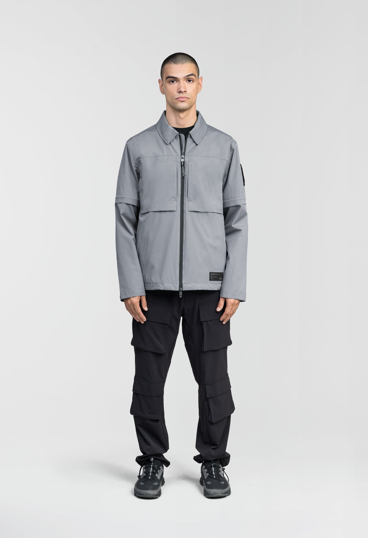 Thurlow Men's Performance Zip Off Sleeve Rain Shirt in hip length, convertible collar, patch chest zipper pockets, hidden in-seam pockets, zip off sleeves, centre front two-way zipper closure, in Concrete