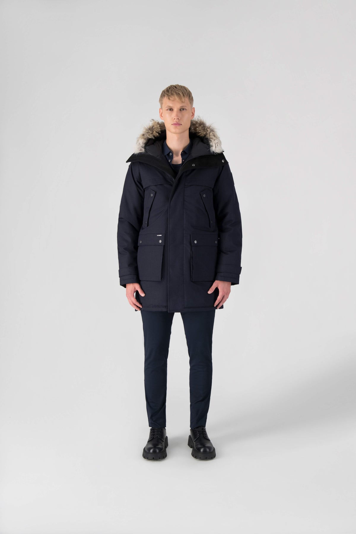 Men's Best Selling Parka the Yatesy is a down filled jacket with a zipper closure and magnetic placket in Navy