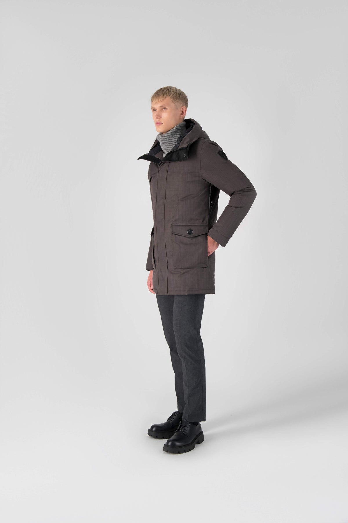 Men's slim fitting waist length parka with removable fur trim on the hood and two waist patch pockets in Steel Grey