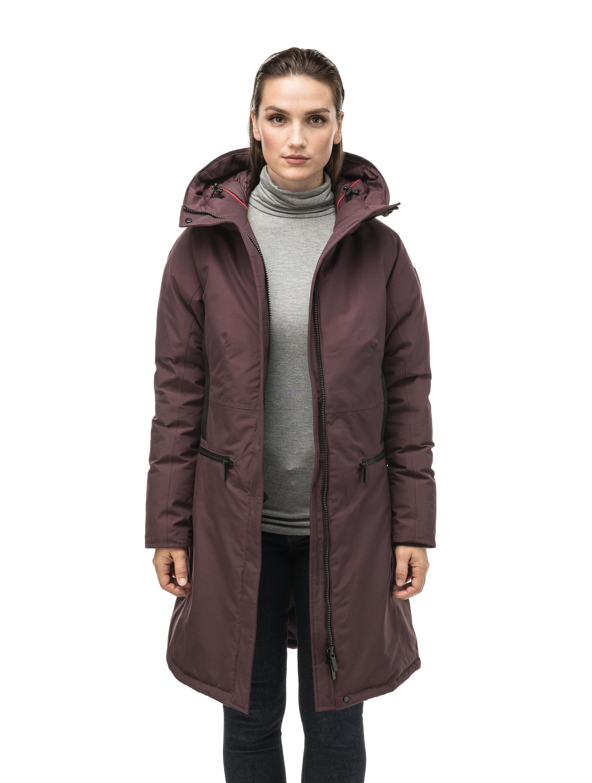 Knee length women's down filled parka with contrast ribbon accents and removable fur trim on the hood in Burgundy