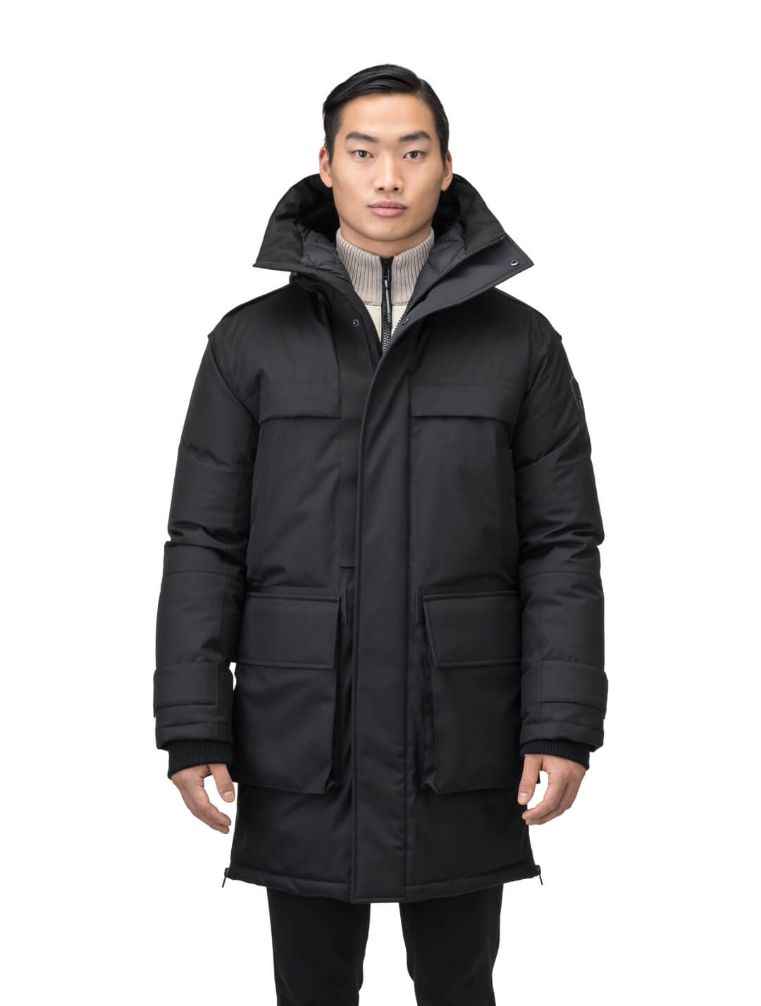 Alum Men's Long Parka in thigh length, Premium Canadian White Duck Down insulation, non-removable hood with removable coyote fur trim, two-way centre front zipper with magnetic closure wind flap, four exterior patch pockets at front, in Black