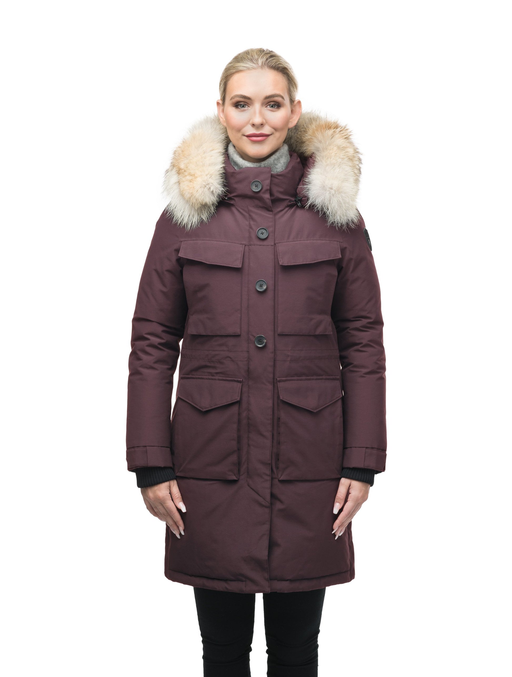 Women's knee length down filled parka with two chest patch pockets and two waist patch pockets in Burgundy