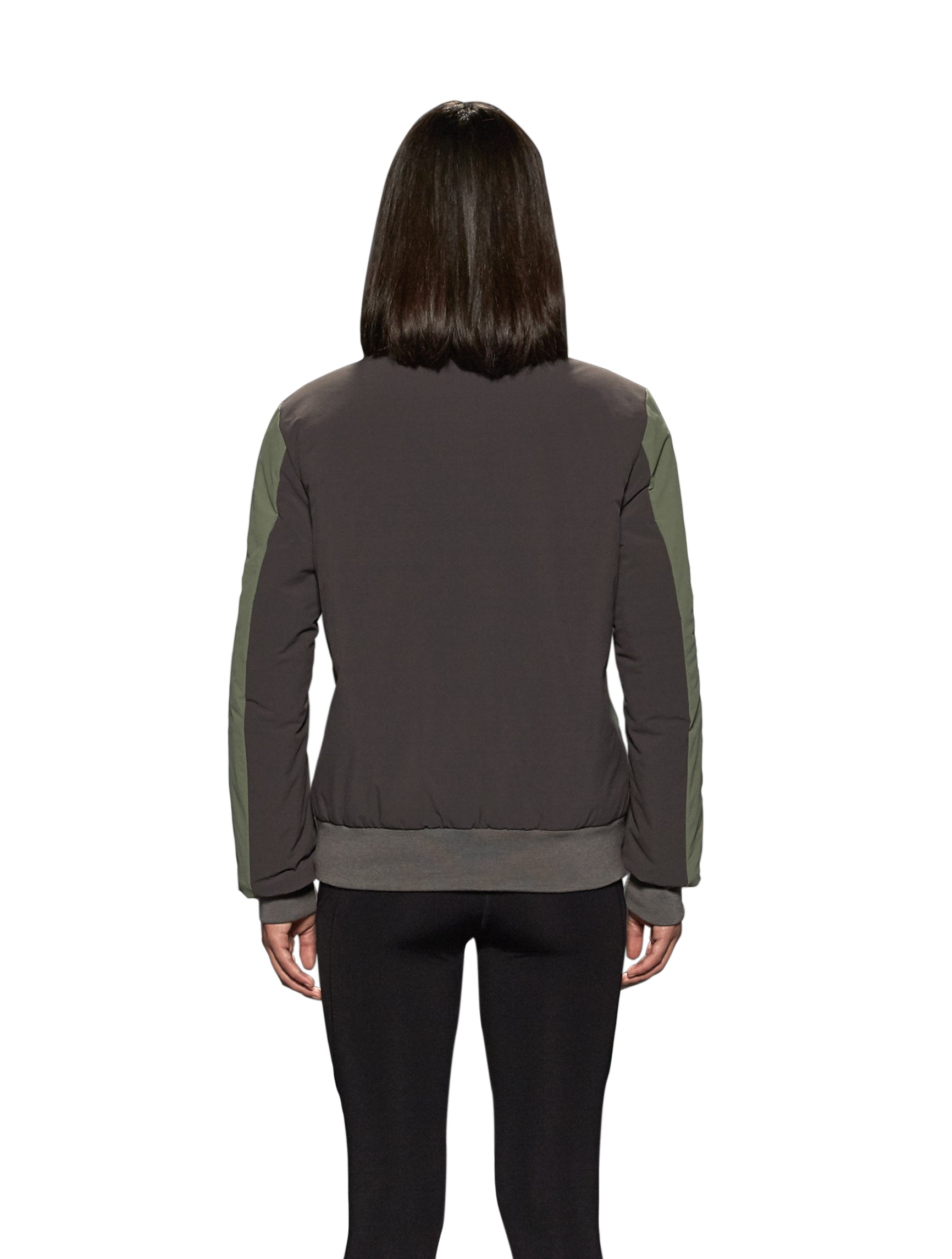 Unisex hip length bomber jacket with a contrast colour back panel, and zipper pockets at waist and an invisible zipper pocket at chest, in Dusty Olive/Licorice