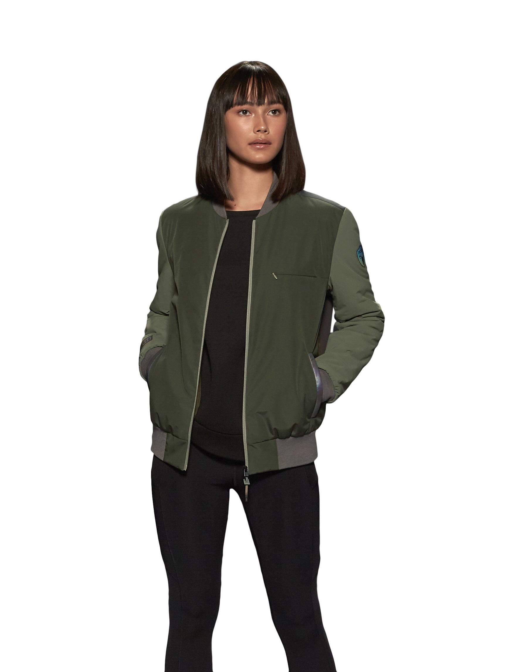 Unisex hip length bomber jacket with a contrast colour back panel, and zipper pockets at waist and an invisible zipper pocket at chest, in Dusty Olive/Licorice