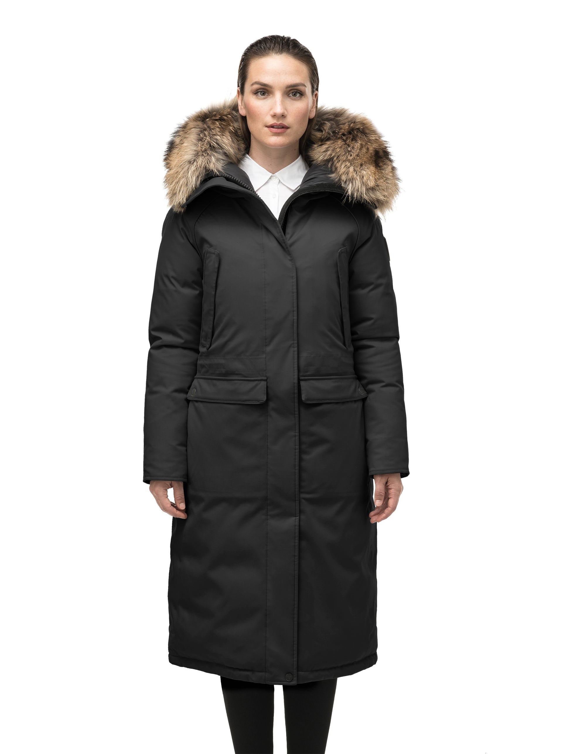 Ladies knee length down-filled parka with four exterior pockets, and a non-removable hood with detachable fur trim in Black