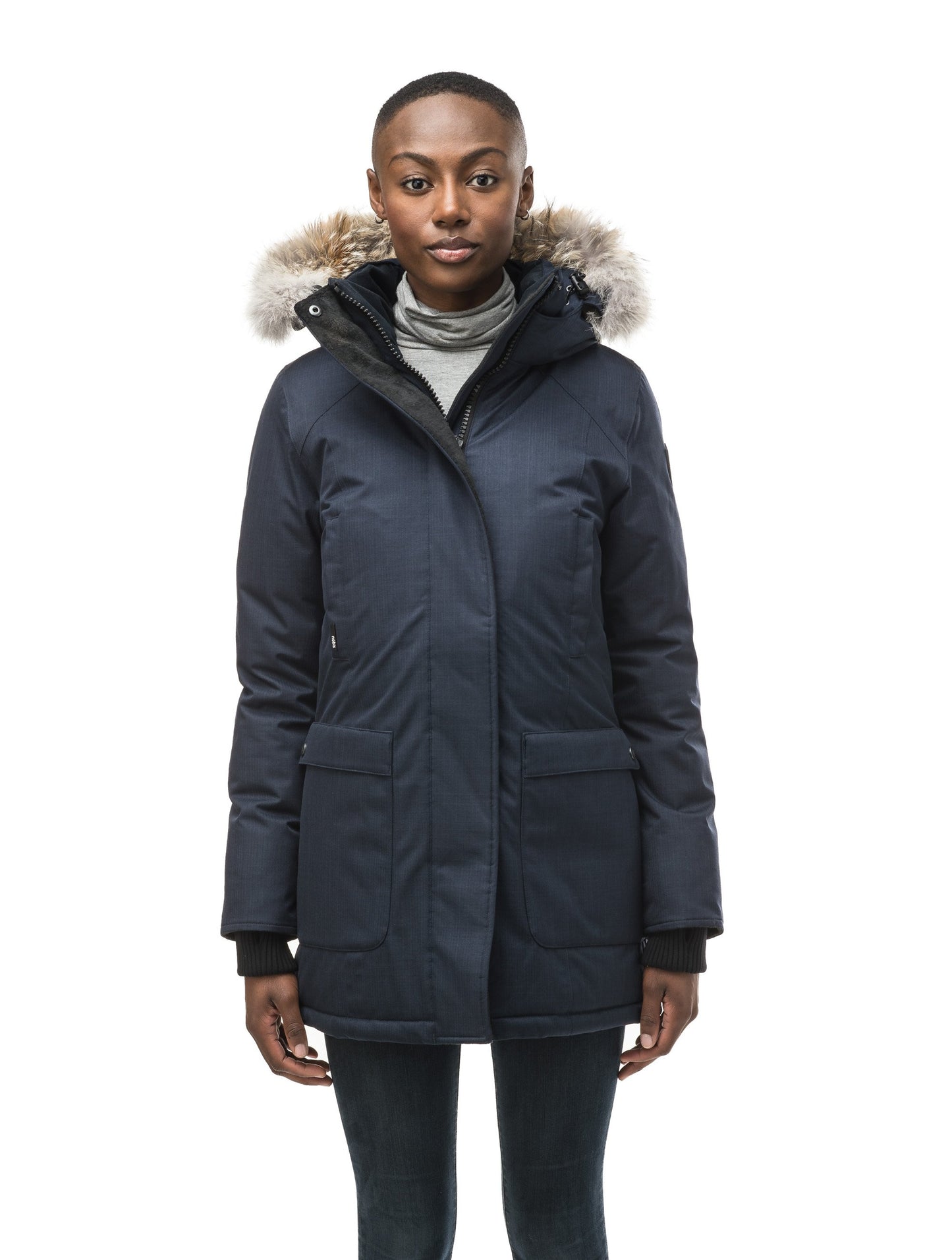 Women's down filled parka that sits just below the hip with a clean look and two hip patch pockets in CH Navy