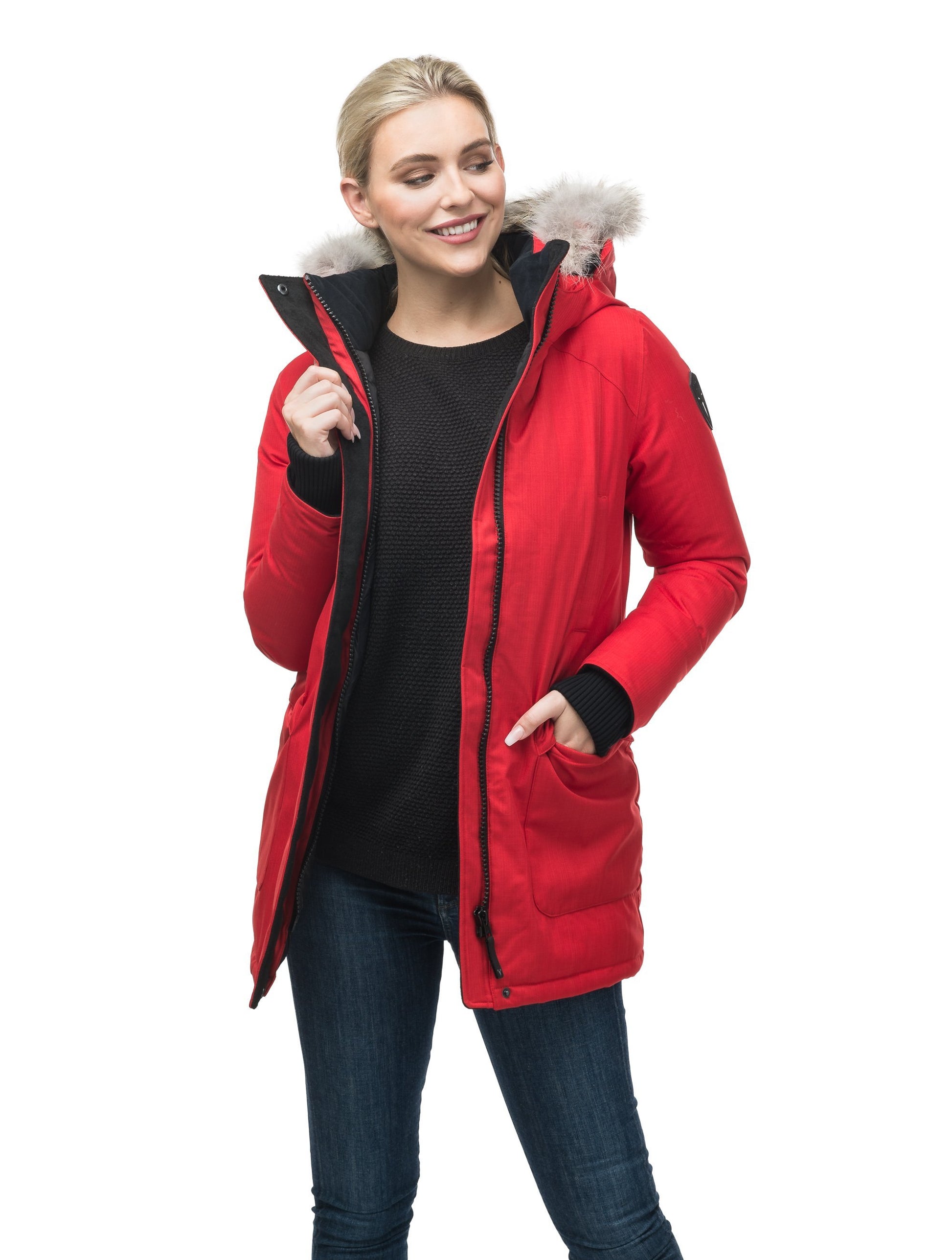 Women's down filled parka that sits just below the hip with a clean look and two hip patch pockets in CH Red