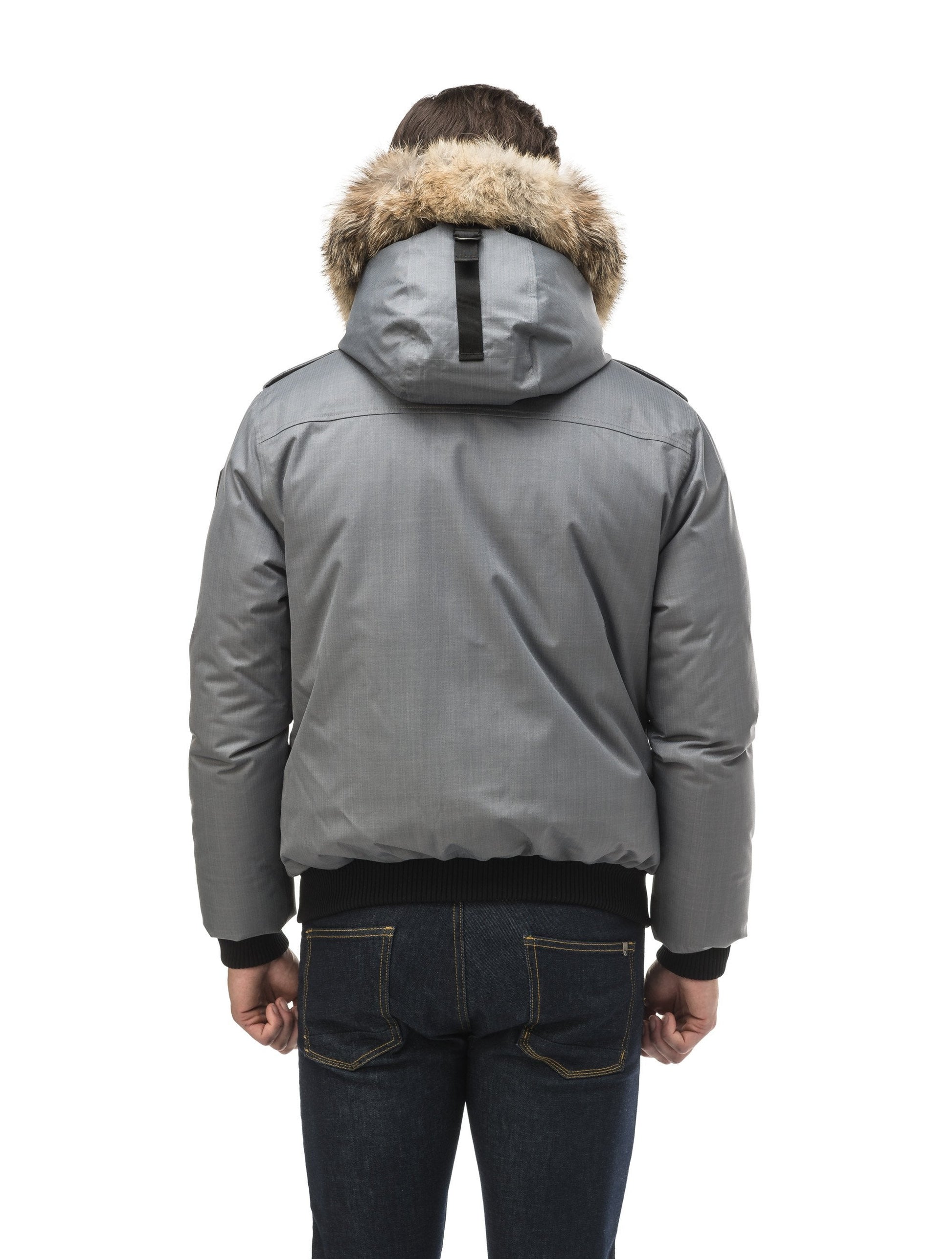 Men's down filled bomber that sits just above the hips with a completely removable hood that's windproof, waterproof, and breathable in CH Concrete