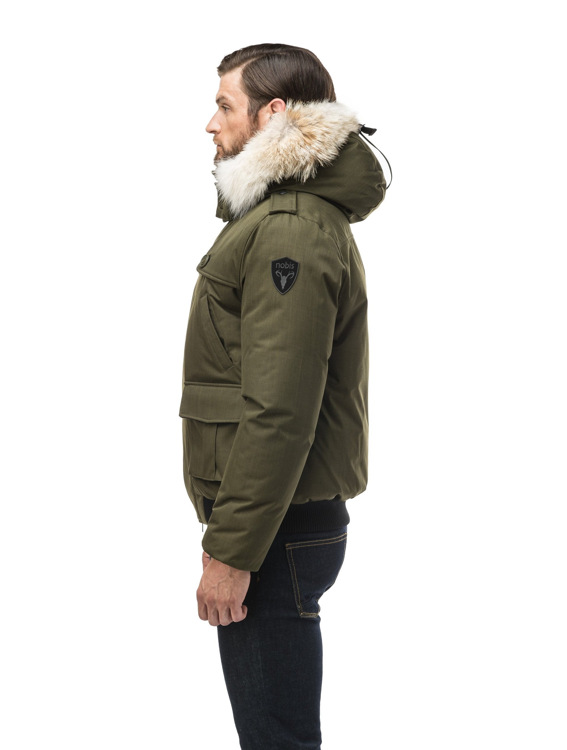 Men's down filled bomber that sits just above the hips with a completely removable hood that's windproof, waterproof, and breathable in CH Fatigue