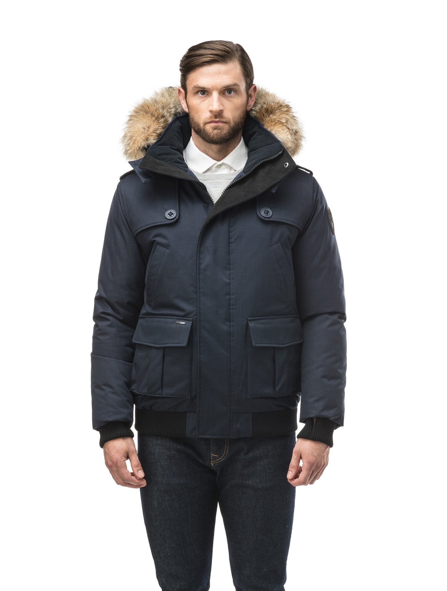 Men's down filled bomber that sits just above the hips with a completely removable hood that's windproof, waterproof, and breathable in CH Navy