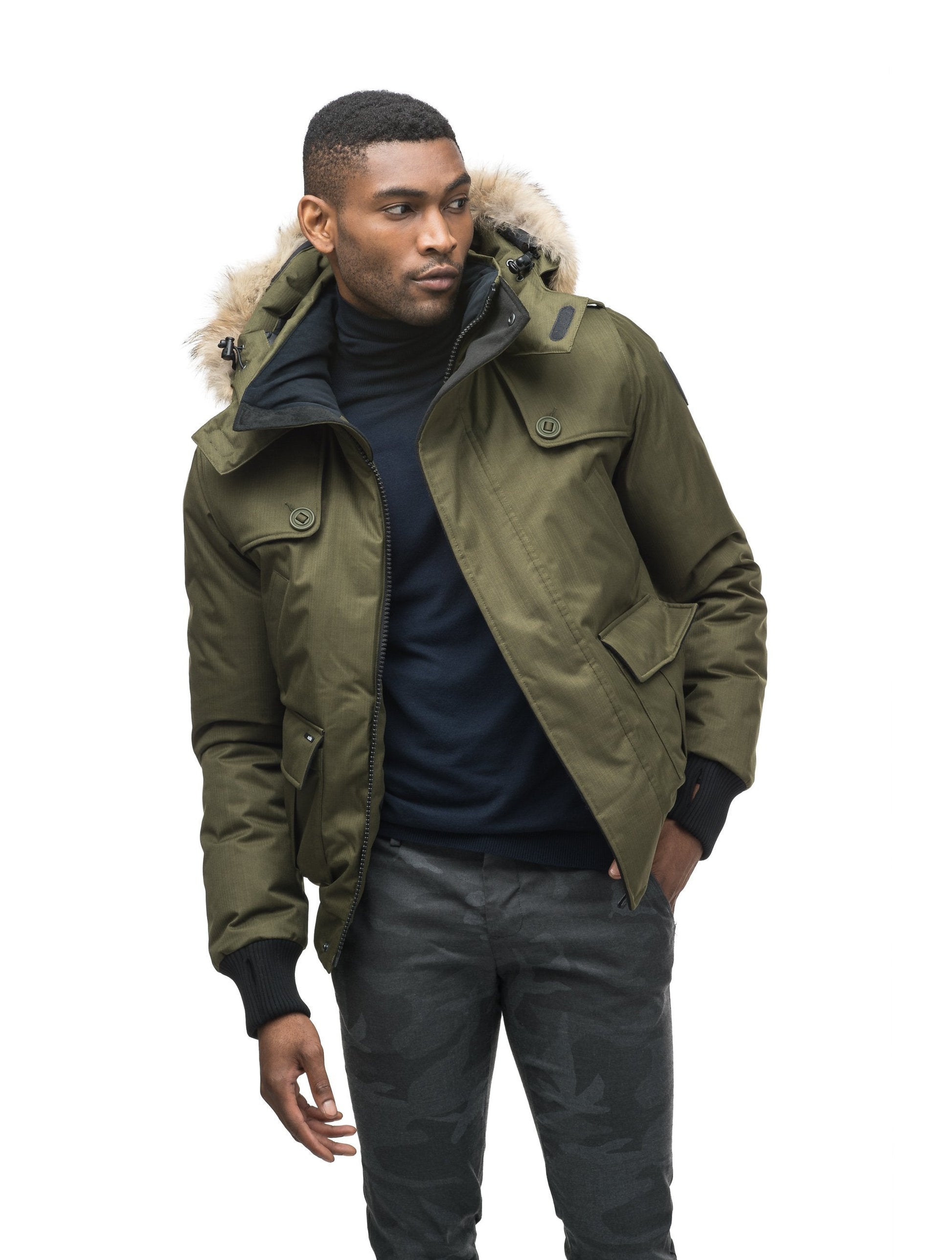 Men's down filled bomber that sits just above the hips with a completely removable hood that's windproof, waterproof, and breathable in CH Fatigue