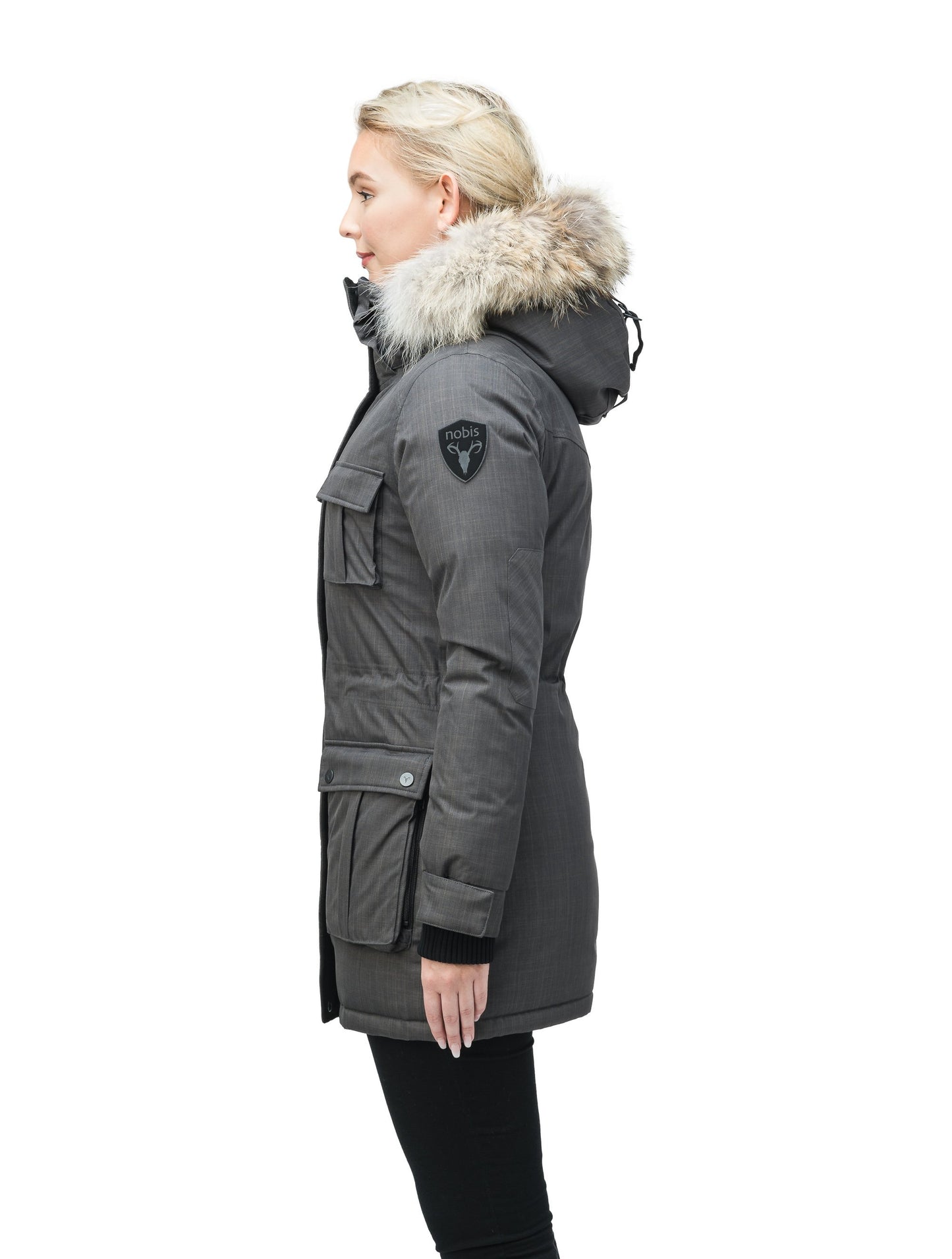 Women's down filled thigh length parka with four pleated patch pockets and an adjustable waist in CH Steel Grey