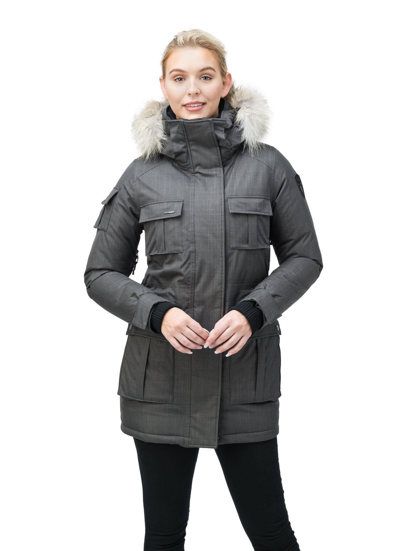 Women's down filled thigh length parka with four pleated patch pockets and an adjustable waist in CH Steel Grey