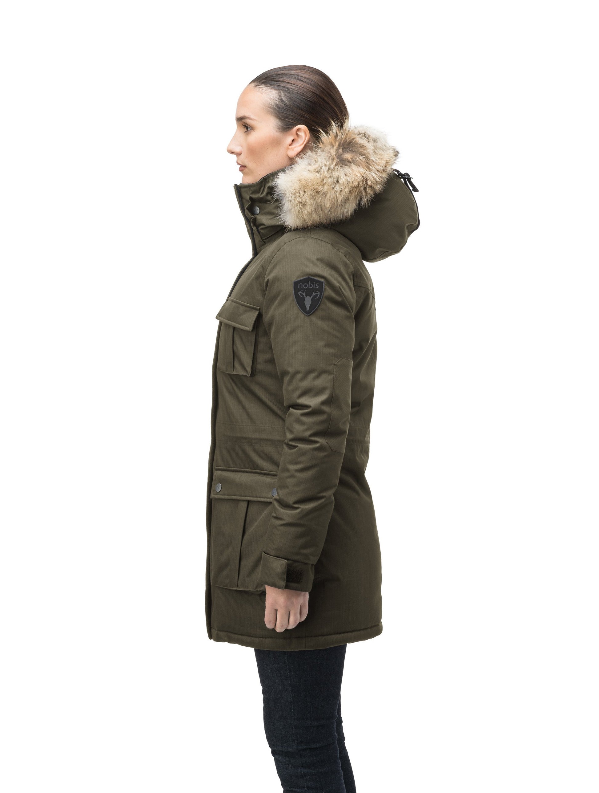 Women's down filled thigh length parka with four pleated patch pockets and an adjustable waist in CH Army Green