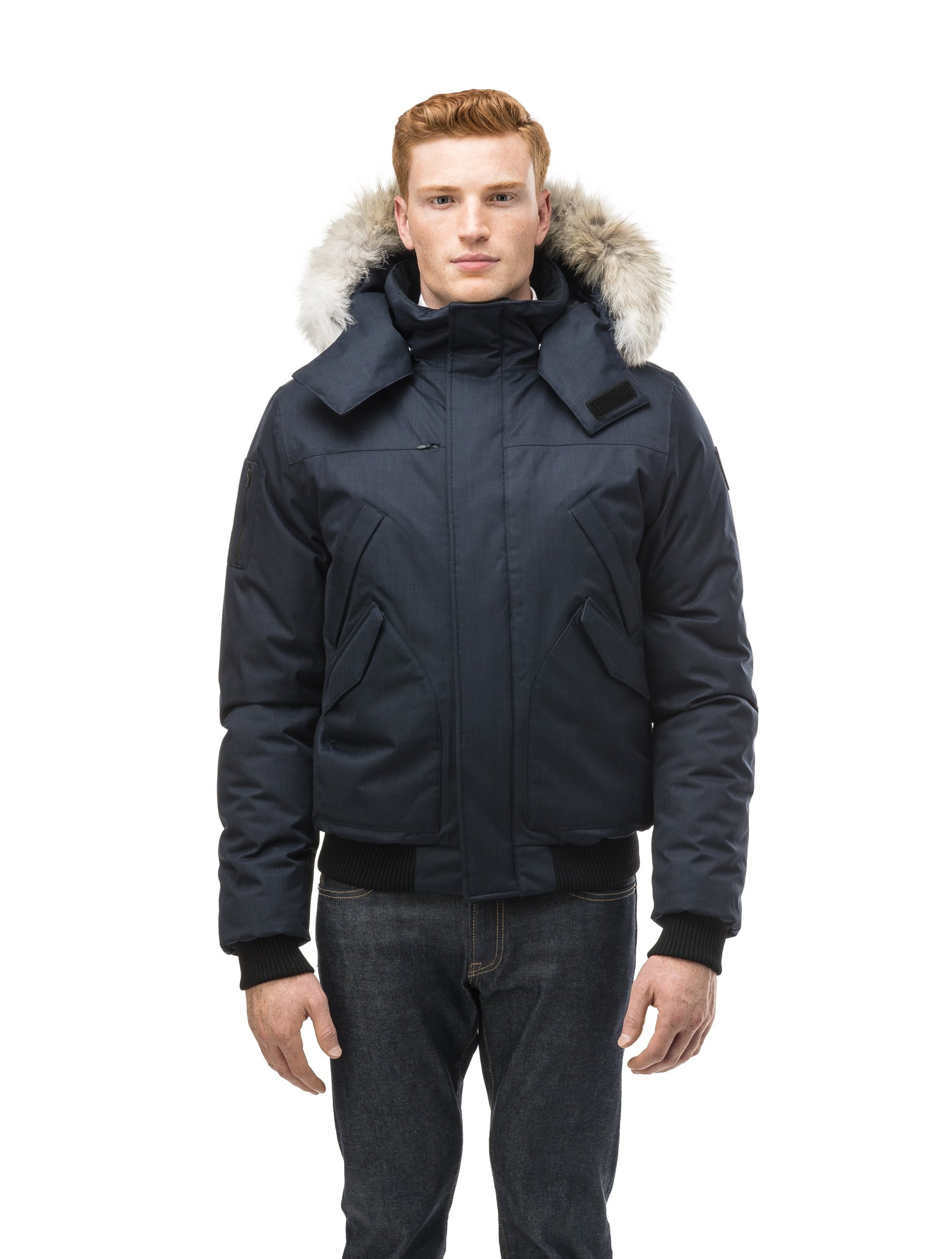 Men's classic down filled bomber jacket with a down filledÃƒâ€šÃ‚Â hood that features a removable coyote fur trim and concealed moldable framing wire in Navy