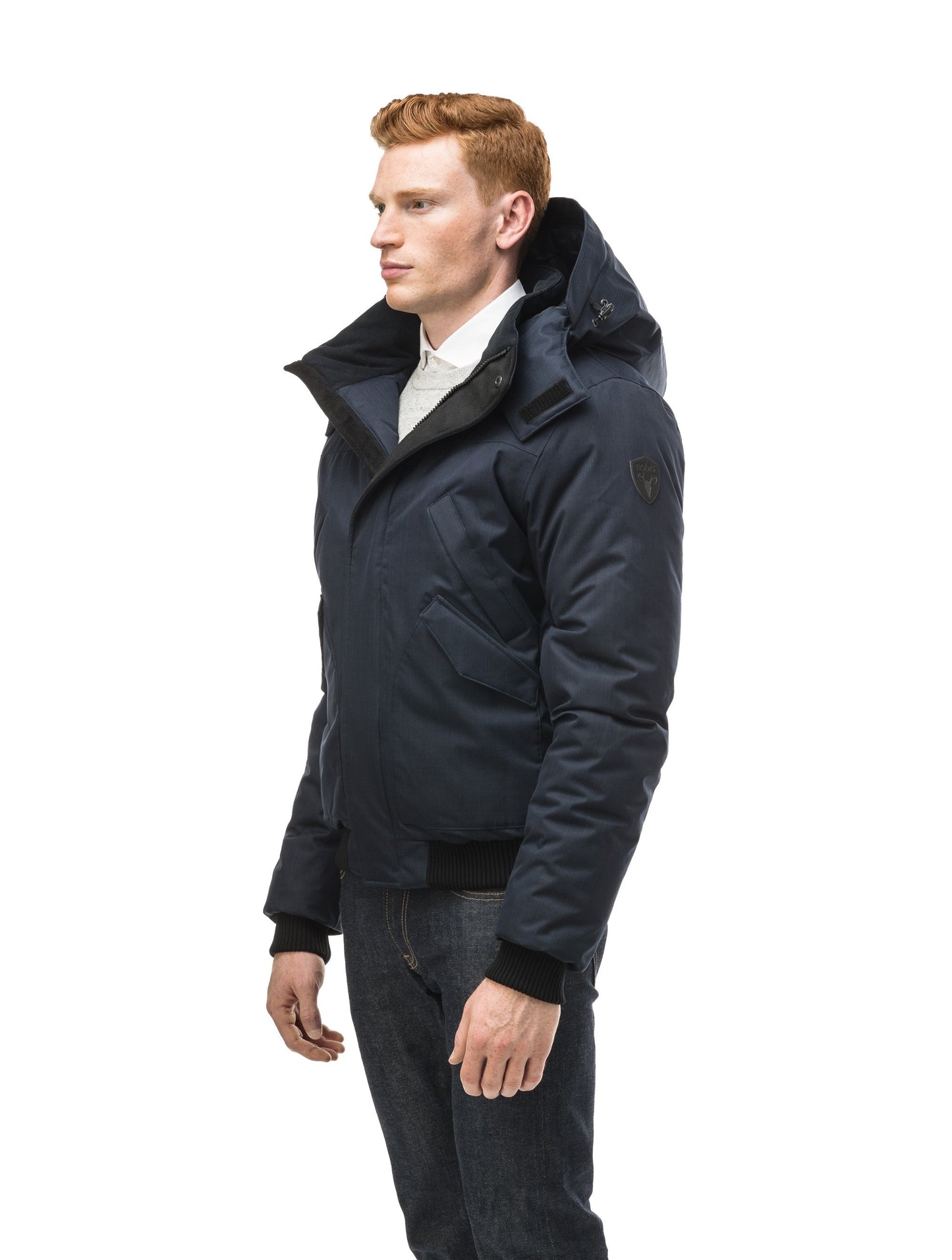 Men's classic down filled bomber jacket with a down filledÃƒâ€šÃ‚Â hood that features a removable coyote fur trim and concealed moldable framing wire in Navy