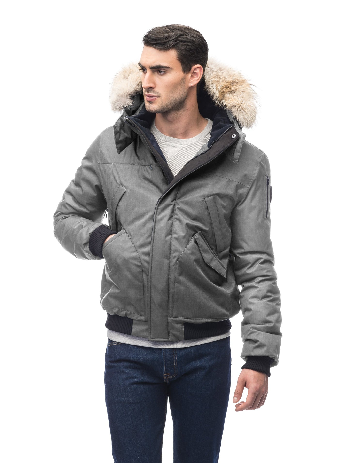 Men's classic down filled bomber jacket with a down filledÃƒâ€šÃ‚Â hood that features a removable coyote fur trim and concealed moldable framing wire in Concrete