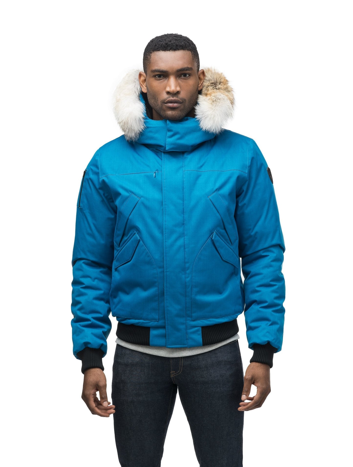 Men's classic down filled bomber jacket with a down filledÃƒâ€šÃ‚Â hood that features a removable coyote fur trim and concealed moldable framing wire in Sea Blue