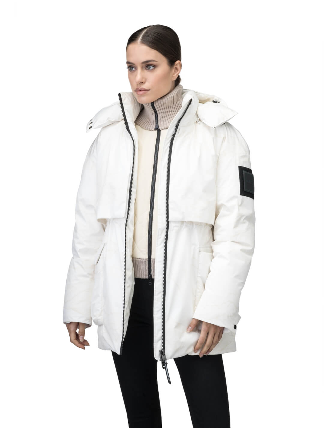 Haelyn Ladies Short Utility Parka in thigh length, 3-Ply Micro Denier fabrication, Premium Canadian White Duck Down insulation, removable down-filled hood, two-way centre front zipper, hidden adjustable cord at waist, adjustable snap cuffs, and four exterior patch pockets at front, in Wheat Desert