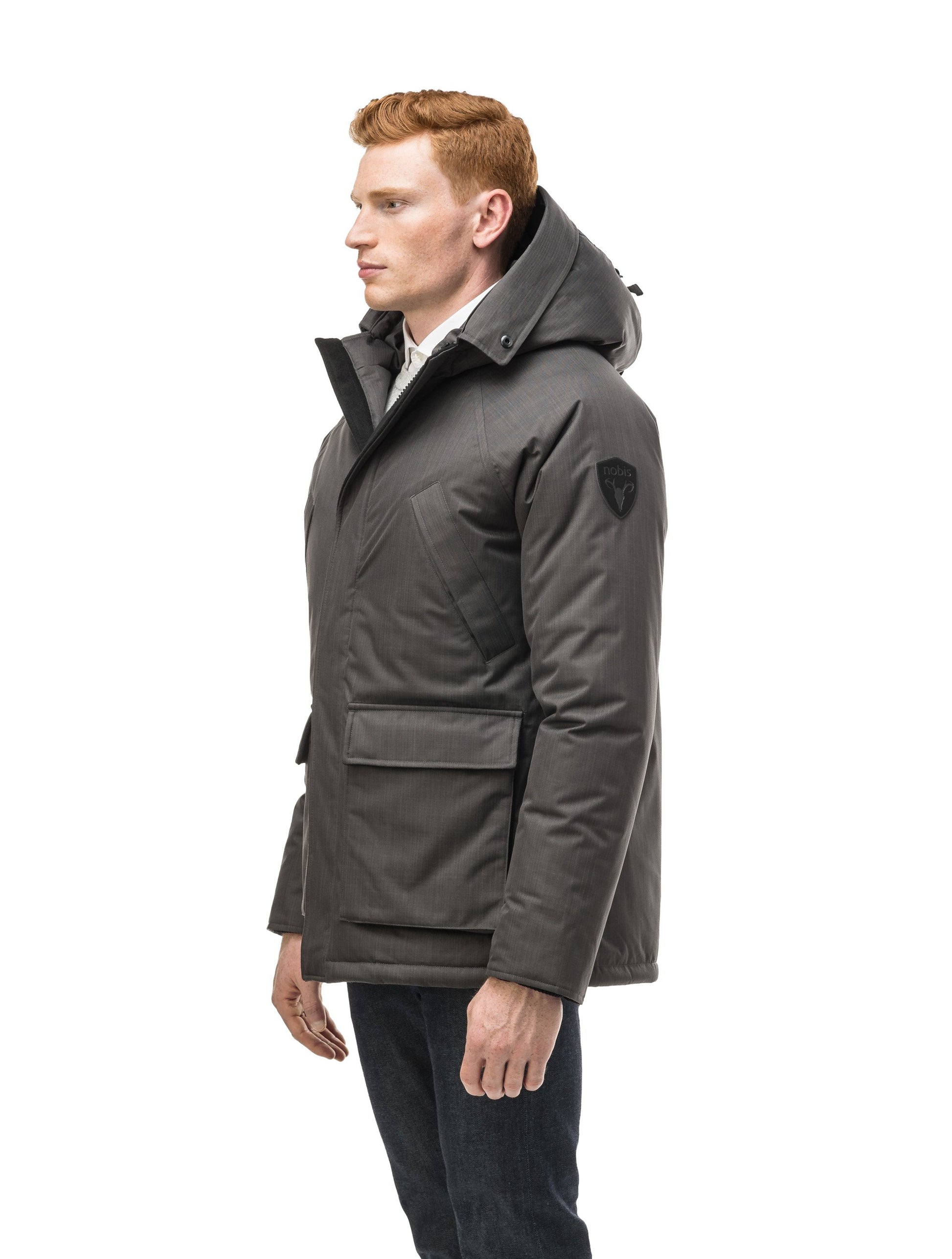 Men's waist length down filled jacket with two front pockets with magnetic closure and a removable fur trim on the hood in CH Steel Grey